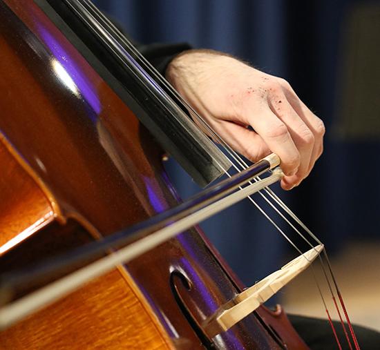 Close-up of Violin being played by a hand and bow